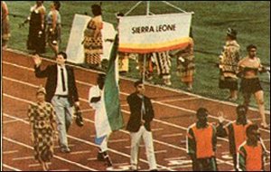 Dr. Wessell marches in the opening ceremonies of the Sierra Leone Delegation at the Commonwealth. - Copyright – Stock Photo / Register Mark