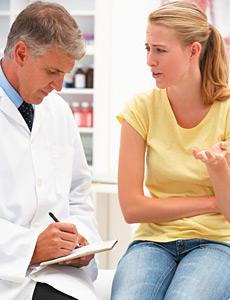 doctor consulting patient - Copyright – Stock Photo / Register Mark