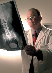doctor viewing xray - Copyright – Stock Photo / Register Mark