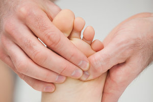 foot massage - Copyright – Stock Photo / Register Mark