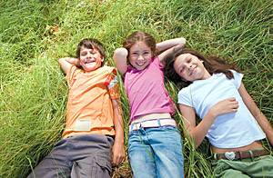 kids in grass - Copyright – Stock Photo / Register Mark