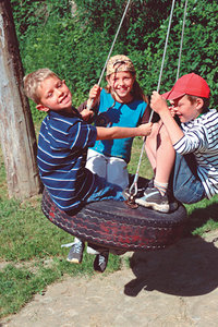 kids playing on swing - Copyright – Stock Photo / Register Mark