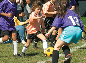 kids playing soccer - Copyright – Stock Photo / Register Mark