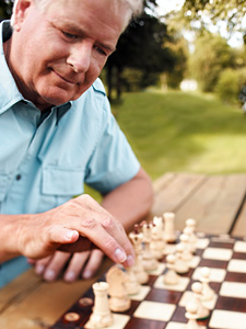 man playing chess - Copyright – Stock Photo / Register Mark